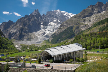 The Mont Blanc Massif with the Brenva glacier and statioin of Vallee Blanche Cable Car over the Entreves - Italy.