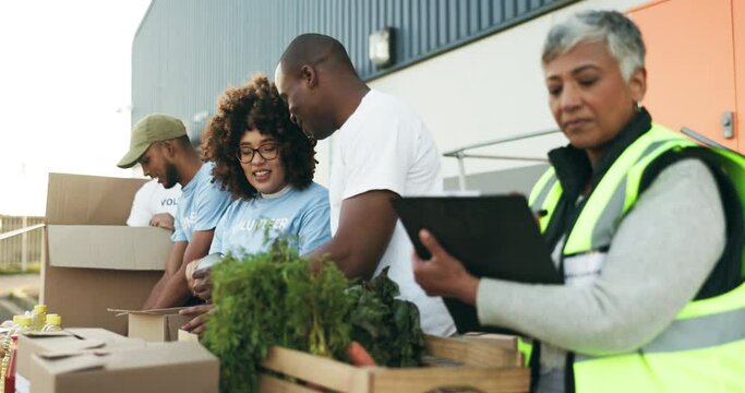 Happy people, volunteer and box in NGO, charity or community service in teamwork together. Group of volunteering workers or team packing parcel, package or boxes in donations, social or contribution