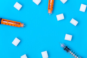 Insulin injection pen on blue background