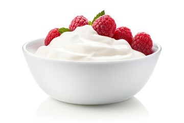 Bowl of creamy yogurt topped with fresh raspberries and mint leaves.