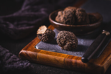 Expensive black truffles gourmet mushrooms - obrazy, fototapety, plakaty