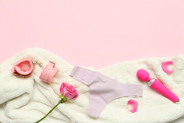 Composition with female panties, sex toys, rose flower and plaid on pink background