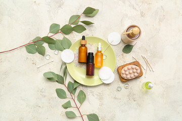 Composition with cosmetic products and eucalyptus branches on light background © Pixel-Shot