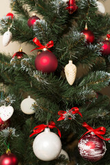 Christmas tree with red decor, closeup view