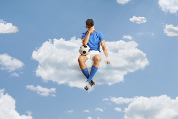 Sad football player sitting on a cloud