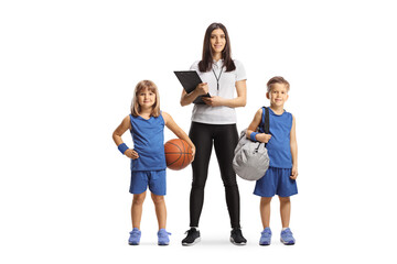 Fototapeta premium Female coach standing with a youth basketball team