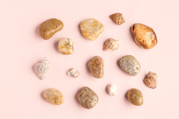 Many pebble stones on pink background
