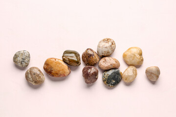 Many pebble stones on white background