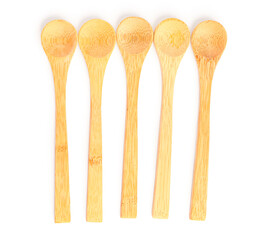 Empty wooden spoons isolated on white background
