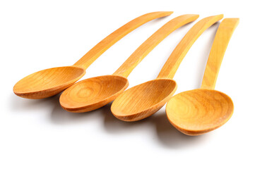 Empty wooden spoons isolated on white background