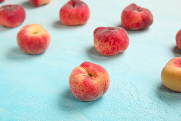 Sweet fig peaches on light blue background
