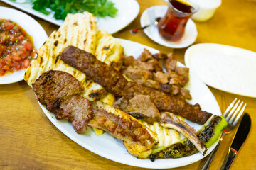 Kirmizi et tabagi. Plate with fried meat, pita bread and stewed peppers. Turkish cuisine