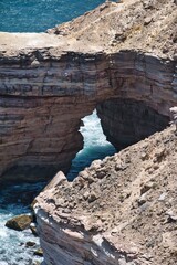 Closeup view of the Natural Bridge at Kalbarri National Park Coastal Cliffs. A natural stone bridge at the coast. Impressive coastal cliffs in Kalbarri National Park, Western Australia. 