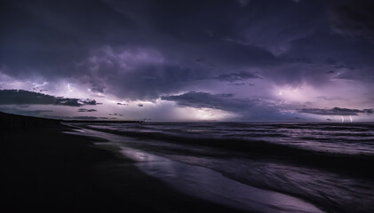 Fototapeta na wymiar Severe thunderstorm and rain with many lightning peals and dense clouds, on the Black Sea coast in Georgia