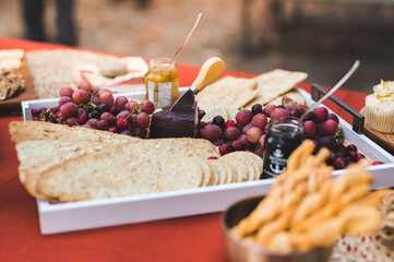 Charcuterie board with grapes, cheese and crackers