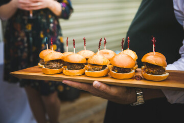 Delicious mini hamburger sliders being served