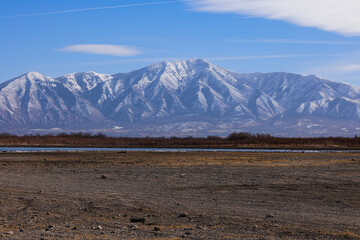 mountains in the background of a lake, utah lake