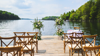 Wedding setup on a dock overlooking a lake