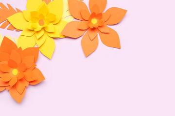 Obraz premium Colorful origami flowers with leaves on purple background