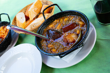 Traditional dish of Asturian cuisine Pote asturiano - thick stew with vegetables and beans added...