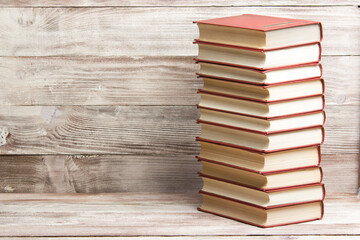 Open book, hardback books on wooden table. Back to school. Copy space	