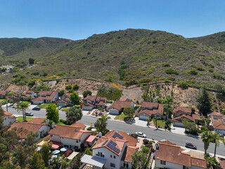 Fototapeta na wymiar Aerial view of small city Poway in suburb of San Diego County, California, United States. Houses next the valley during dry season