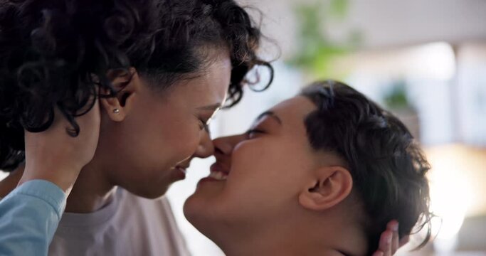 LGBT love, bedroom and lesbian couple kiss, care and support for gay women, trans girlfriend or partner. Relax, comfort and happy people bonding, connect and enjoy morning together in home apartment