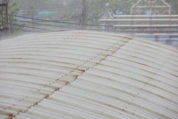 Raindrops on corrugated metal roof