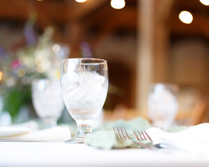 light and airy floral table setting, with whites, tans and greens.