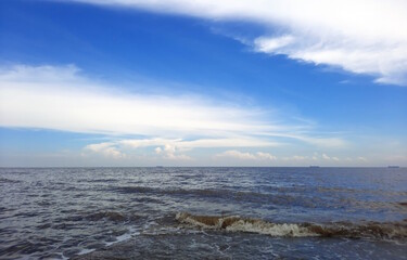 open sea with cloudy blue sky