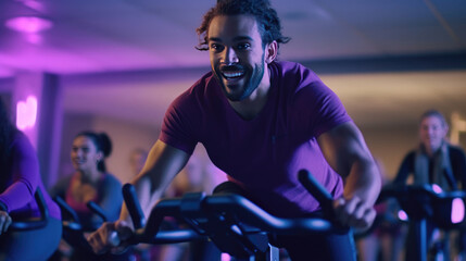 Fototapeta na wymiar A group fitness classes, exercising on a spinning bike in the gym