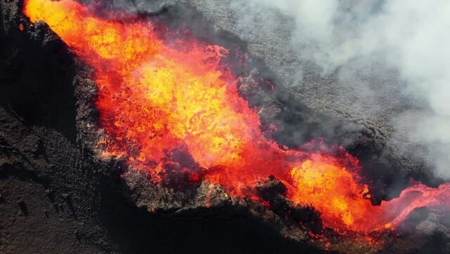 4K Drone aerial video of Iceland Volcanic eruption 2023. The volcano Litli-Hrutur is located in the valley Reykjanes close to Grindavik and Reykjavik. Hot lava and magma coming out of the crater.
