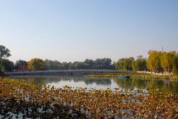 Long historical bridge in In the Beihai Park in Beijing China