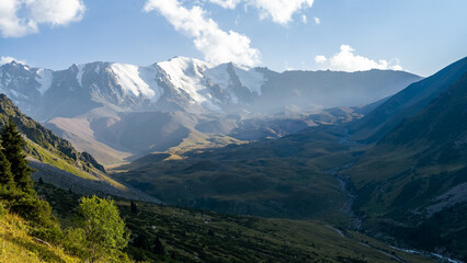 beautiful snowy mountain peaks in the clouds. highlands