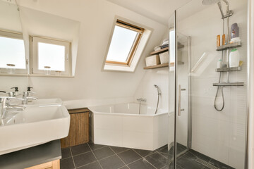 a modern bathroom with skylights on the window and tub in the shower is next to the sink, which has been used for