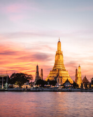Wat Arun Temple during Sunset at Chao Praya River Bangkok, Thailand.