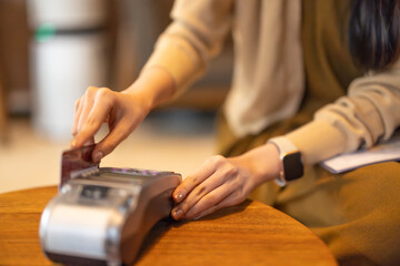 Stylish young women shop online using cards, bitcoin. Enjoy loyalty discounts coupons, fast shipping