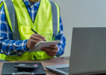 revenue calculation engineer construction costs on the desk.concept of capital analysis Recurring income and expenditure.selective focus