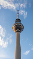 The famous TV Tower of Berlin shone by the last warm rays of sunlight