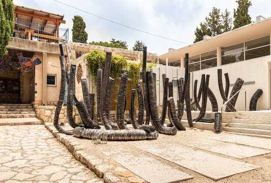 Abstract installation of curved pipes for an air conditioner made by a local artist in the famous artists village Ein Hod near Haifa in northern Israel