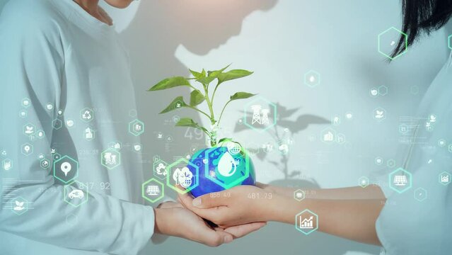 Two children holding a planet earth with plant and environment technology concept. Sustainable development goals. SDGs.