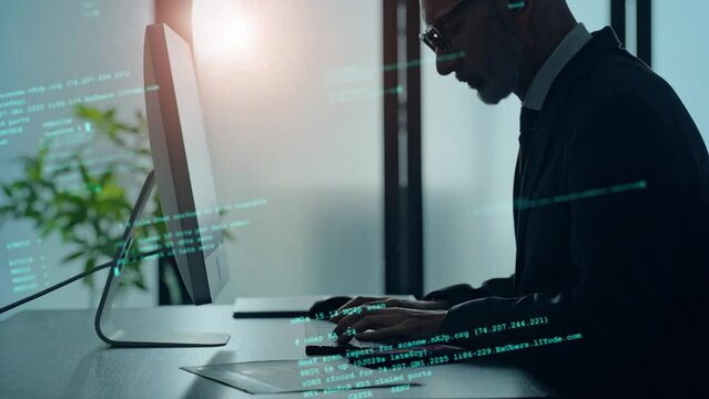Middle aged businessman working in office and programming code concept.