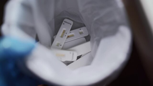 Medical staff disposing used Covid-19 antigen test kits