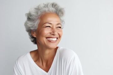Beautiful gorgeous 50s mid age beautiful elderly senior model woman with grey hair laughing and smiling. Mature old lady close up portrait. Healthy face skin care beauty, skincare cosmetics, dental. - obrazy, fototapety, plakaty