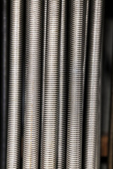 Macro photo of threaded rod in a row