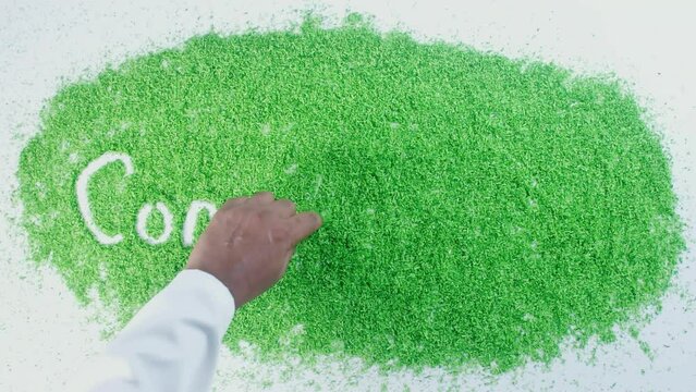 Word conservation written in green sand