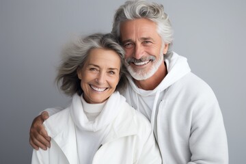 Beautiful gorgeous 50s mid age elderly senior model couple with grey hair laughing and smiling. Mature old man and woman close up portrait. Healthy face skin care beauty, skincare cosmetics, dental.