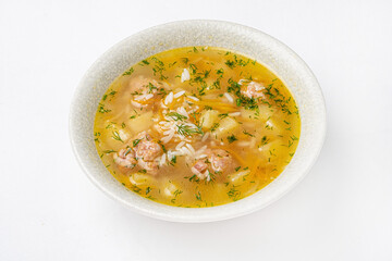 soup with meatballs on the white