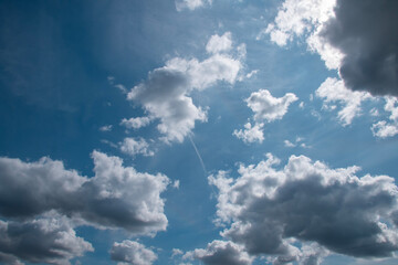 Fototapeta premium Summer sky with storm clouds. Beauty is clear, cloudy, in sunlight. Gloomy bright blue landscape in the environment day.