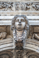 Venice, Italy - Portrait with a ancient wall decoration sculpture of a beautiful woman, Greek or Italian in historical downtown of Venice